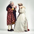 Even royals have problems. Studio shot of a king and queen arguing.