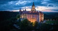 Evening aerial, panoramic view of the illuminated Ksiaz Castle, Schloss FÃ¼rstenstein, Poland.