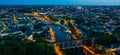 Evening aerial view of Laval with buildings, river Mayenne and old bridge