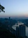 City night view of Chongqing, China after sunset. Skyscrapers on the banks of the Jialing River and the busy city traffic