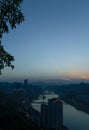 City night view of Chongqing, China after sunset. Skyscrapers on the banks of the Jialing River and the busy city traffic