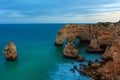 Evening Atlantic rocky coastline near Lagoa, in Algarve, Portugal.