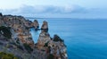 Evening Atlantic rocky coastline (Algarve, Portugal). Royalty Free Stock Photo