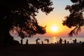 On the evening beach resting people. Sunset.