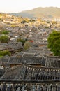 Evening bird eye view of local historical architecture roof building of Old Town of Lijiang in Yunnan, China Royalty Free Stock Photo