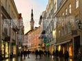 Evening blurred city light Christmas in Tallinn old town holiday decoration panorama ,people walking ,travel in Europe, winter sun