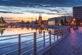 Evening on the boulevards on the Oder river in WrocÃâaw. Illuminated historic buildings and bridges. Beautiful sky and reflections