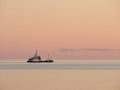 Evening calm sea with the ship Royalty Free Stock Photo