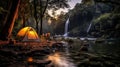 Evening camp setup beside waterfall in forest with chairs and tent. Shallow depth of feld Royalty Free Stock Photo