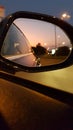 Evening in the car mirroir Royalty Free Stock Photo
