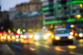 Evening city traffic in a giant metropolis.City light bokeh background.Defocused night traffic lights. Royalty Free Stock Photo