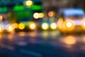 Evening city traffic in a giant metropolis.City light bokeh background.Defocused night traffic lights. Royalty Free Stock Photo