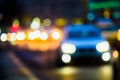 Evening city traffic in a giant metropolis.City light bokeh background.Defocused night traffic lights. Royalty Free Stock Photo