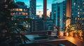 Evening city view from a home office with plants and computer Royalty Free Stock Photo