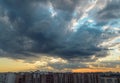 Evening the city was covered with the shadow of a big cloud