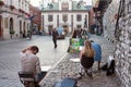 Evening cityscape - artists who paint on the streets in the Krakow Old Town