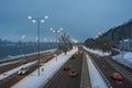 Evening cityscape with auto on highway Royalty Free Stock Photo