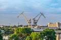 Evening cityscape of Mykolaiv with two port cranes on the horizon, Ukraine Royalty Free Stock Photo