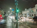 Evening cityscape in rainy weather. Cars and night lights. City of Saratov, Russia Royalty Free Stock Photo