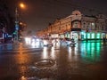 Evening cityscape in rainy weather. Cars and night lights. City of Saratov, Russia Royalty Free Stock Photo