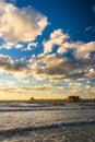 Evening clouds over the fishing pier and Gulf of Mexico in Naples, Florida. Royalty Free Stock Photo