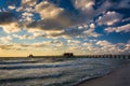 Evening clouds over the fishing pier and Gulf of Mexico in Naples, Florida. Royalty Free Stock Photo