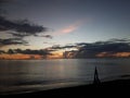 Evening colours dashes of black clouds with fiery orange sun rays