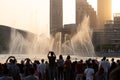 The evening Dubai Fountain show with audience taking photographs