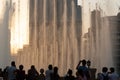 The evening Dubai Fountain show with audience taking photographs