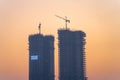 Evening dusk shot of Trump Towers under construction building skyscraper in gurgaon showing rapid growth of Royalty Free Stock Photo