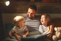 evening family reading. father reads children . book before going to bed Royalty Free Stock Photo