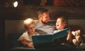 evening family reading. father reads children . book before going to bed Royalty Free Stock Photo