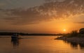 Evening fishing. Evening bright dramatic sunset over the river Royalty Free Stock Photo