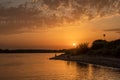 Evening fishing. Evening bright dramatic sunset over the river Royalty Free Stock Photo