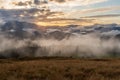 Evening fog over the mountains. Evening sun and fog in the forest. Landscape and horizon. Royalty Free Stock Photo