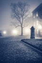 Evening foggy street of old european town Royalty Free Stock Photo