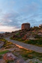 Sardinia.  Portoscuso.  Evening glimpse with the walkway on the Paleturri cliff, under the ancient coast guard tower Royalty Free Stock Photo