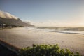 Evening golden light sunset in Camps Bay, Cape Town. Empty beach