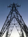 Evening high voltage power lines, electricity tower / pylon, diminishing perspective Royalty Free Stock Photo