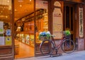 Evening illuminated antique shop bicycle Royalty Free Stock Photo