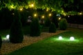 Evening illumination backyard light garden with electric ground sphere lantern.