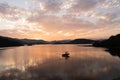 The evening lake reflected the sunset glow and mountains Royalty Free Stock Photo