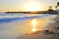 Evening landscape on the beach. In the foreground, footprints in the sand in the sea from the feet of man Royalty Free Stock Photo