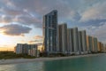 Evening landscape of sandy beachfront in Sunny Isles Beach city with luxurious highrise hotels and condo buildings on Royalty Free Stock Photo
