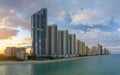 Evening landscape of sandy beachfront in Sunny Isles Beach city with luxurious highrise hotels and condo buildings on Royalty Free Stock Photo