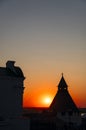 Evening landscape with the silhouette of an ancient fortress tower. Royalty Free Stock Photo