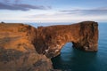 Evening landscape with views of the rocky cape and ocean in Iceland