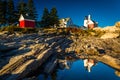 Evening light on rocks and Pemaquid Point Lighthouse, Maine. Royalty Free Stock Photo