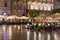 Evening at market square Krakow with empty terraces while raining Royalty Free Stock Photo