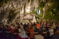 Evening Mass service at the Massabielle Grotto, Rosary Basilica, Lourdes Royalty Free Stock Photo